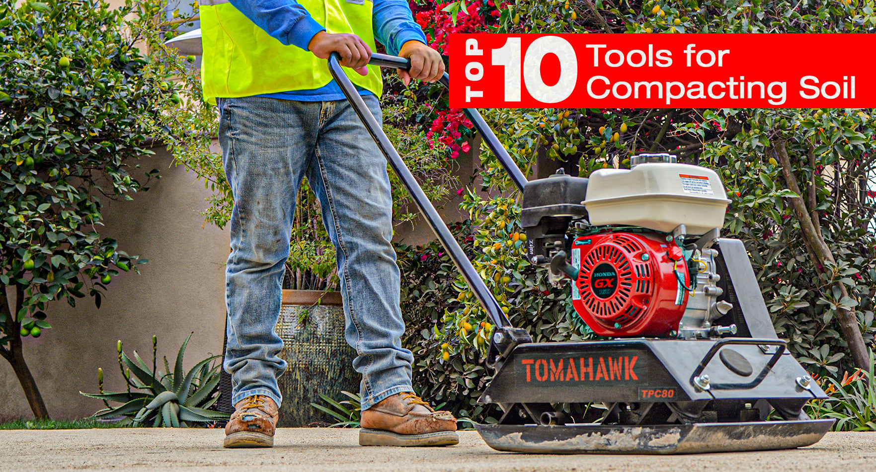 Man using a plate compactor to demonstrate the top tools for compacting soil 